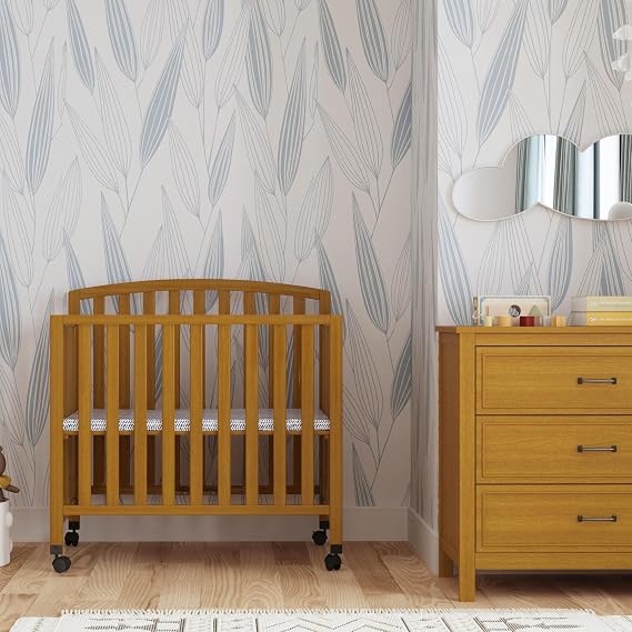 Davinci Dylan Folding Portable 3-in-1 Convertible Mini Crib in Chestnut, Greenguard Gold Certified | GREENGUARD Gold Certified - Folding Baby Crib With Wheels, 4 Adjustable Mattress Heights, Conversion Kit Sold Separately